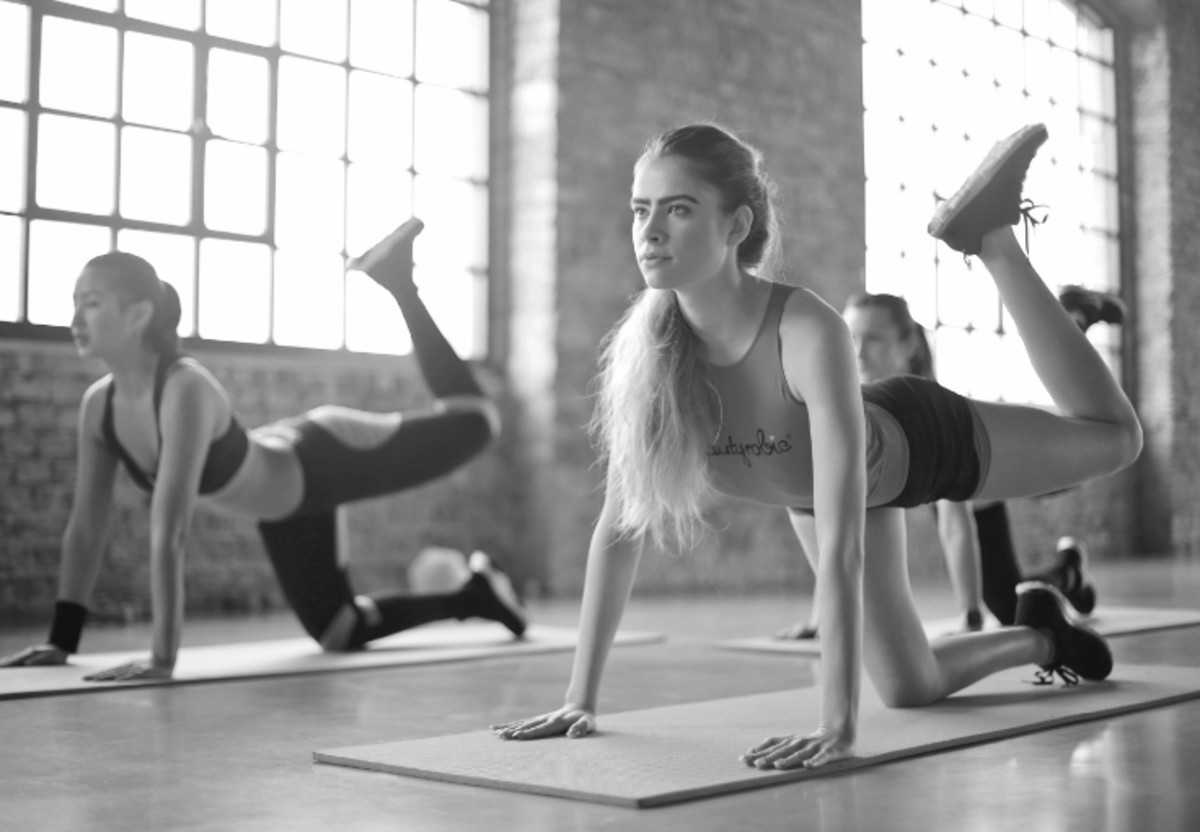 two women doing yoga
