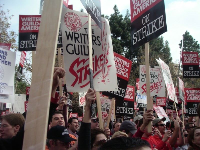 Writers raise signs at wga rally