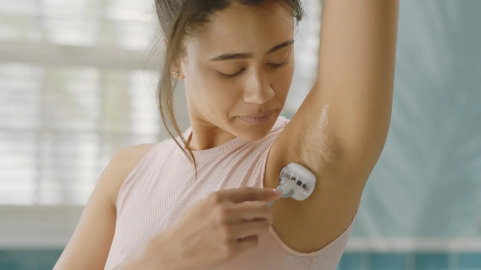 Woman Shaving Armpit Hair