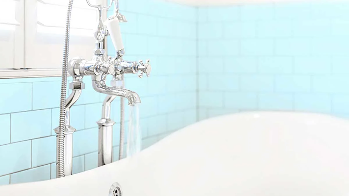 Filling the bathtub with water.