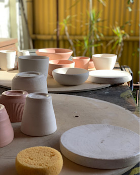 A collection of small pottery on an outdoor table