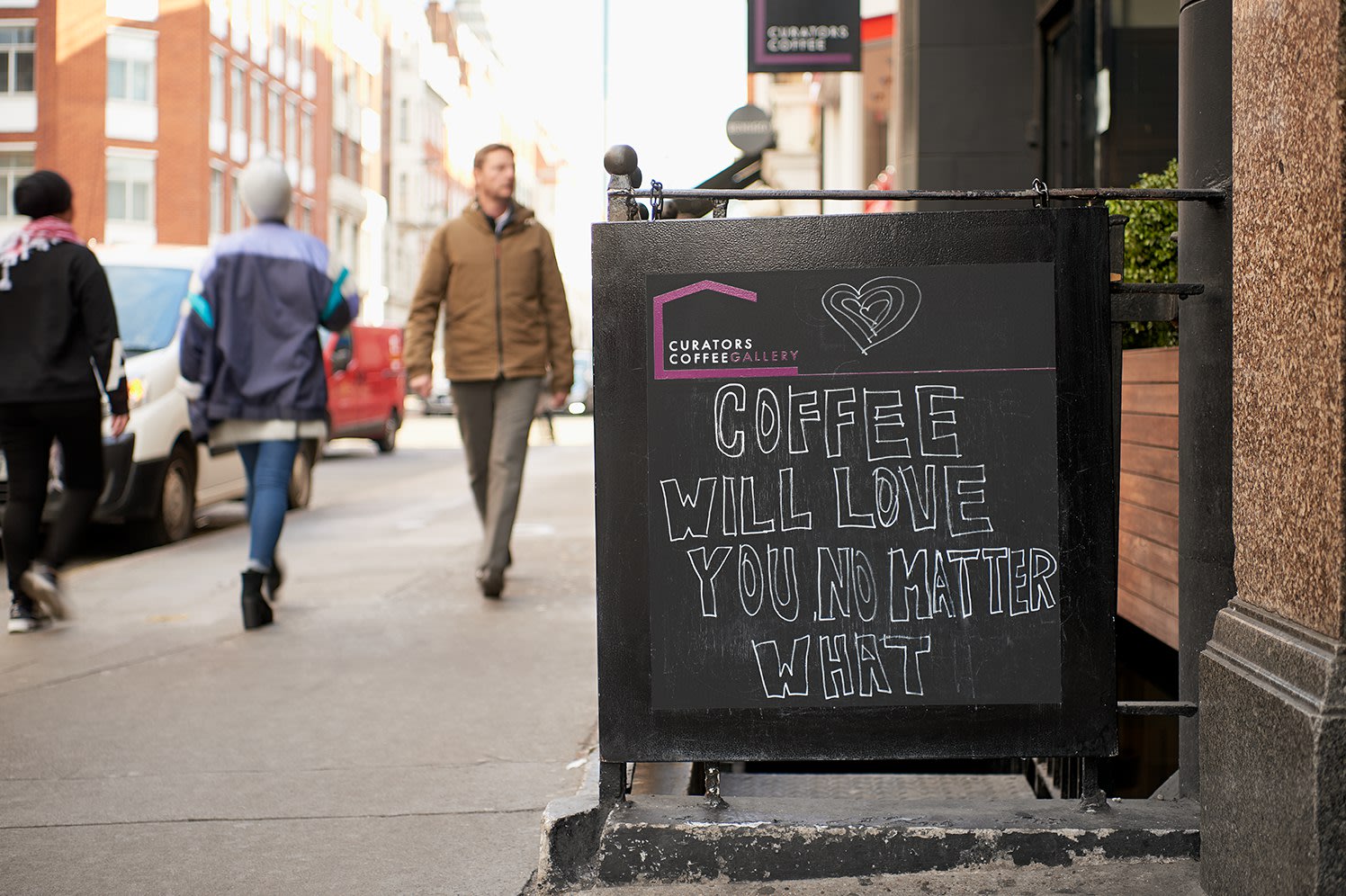 how to create a coffee shop marketing plan, image of a sidewalk promotion for a coffee shop