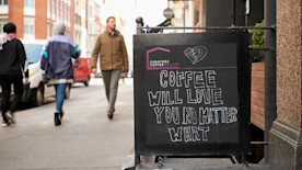 how to create a coffee shop marketing plan, image of a sidewalk promotion for a coffee shop