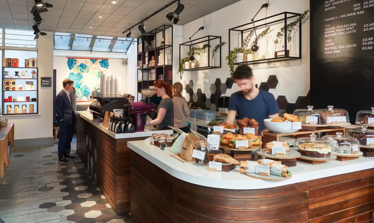 how to create a coffee shop marketing plan, image of a sidewalk promotion for a coffee shop