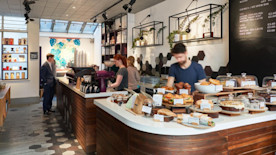 how to create a coffee shop marketing plan, image of a sidewalk promotion for a coffee shop