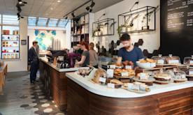 how to create a coffee shop marketing plan, image of a sidewalk promotion for a coffee shop