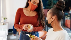 Salon owner selling a product on commission, showing the diversity of salon pay structures.