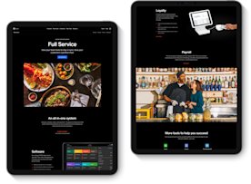 Full service marketing page mocked up in two black ipads.