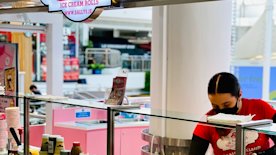 Sally's staff preparing hand rolled ice cream in the kiosk at Tallagh Shopping Center
