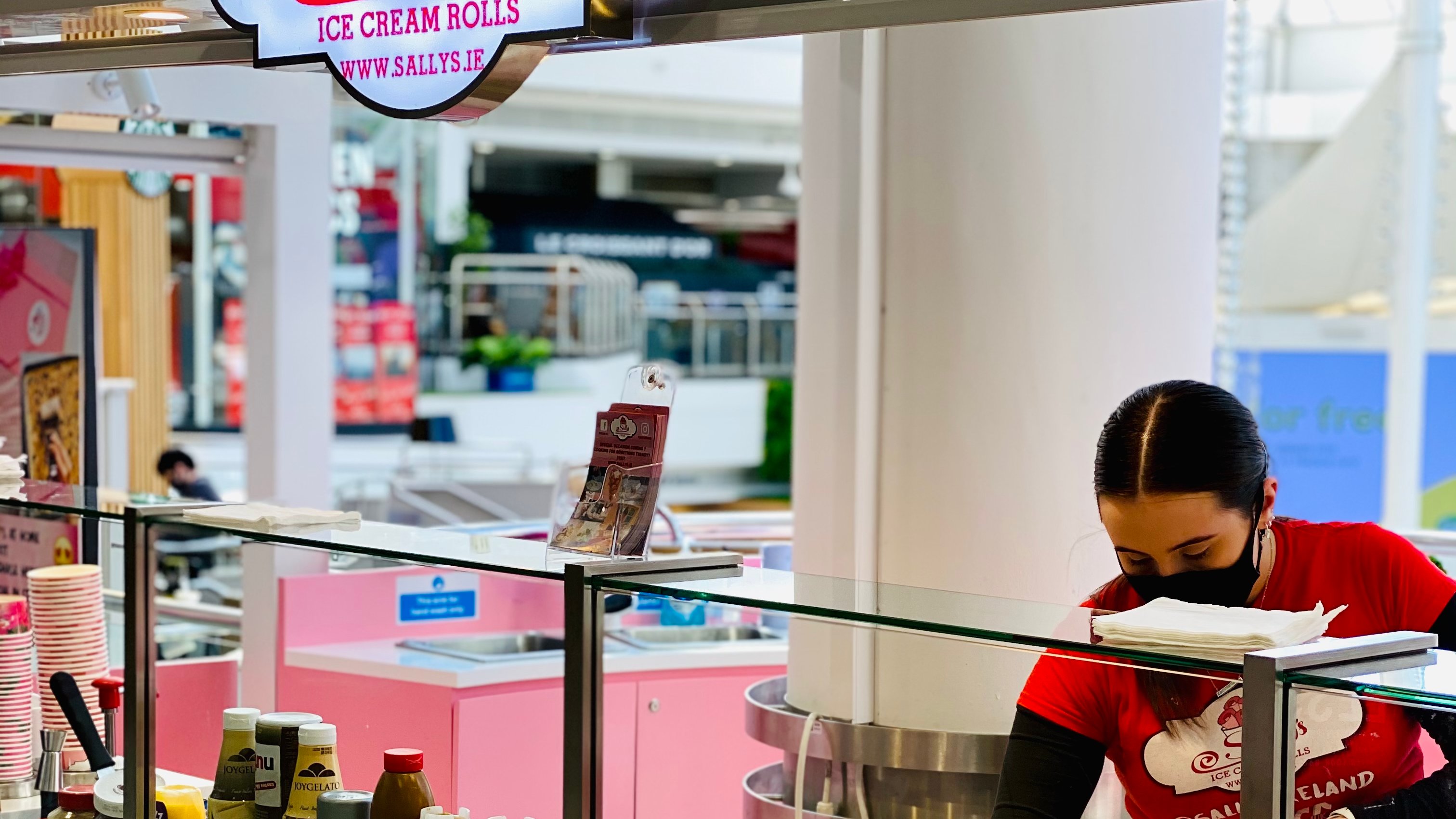 Sally's staff preparing hand rolled ice cream in the kiosk at Tallagh Shopping Center