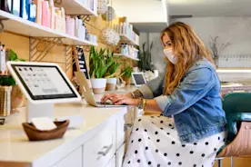 salon owner cutting client's hair