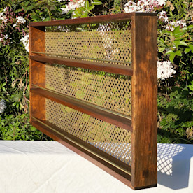 a dark wooden and brass three-tier spice rack