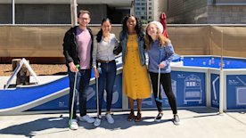 photo of 4 people with miniature golf clubs