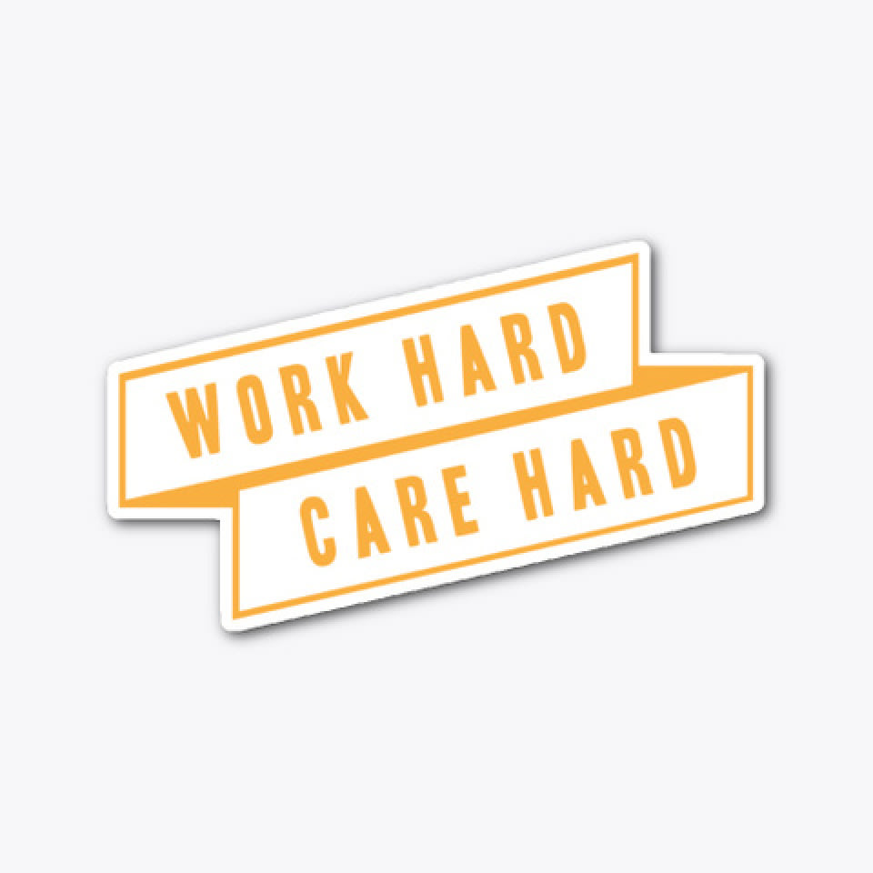 A white banner style sticker with yellow writing that reads WORK HARD CARE HARD