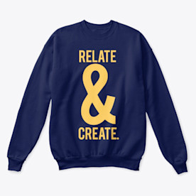 a blue crew-neck sweater with yellow writing that reads RELATE & CREATE.