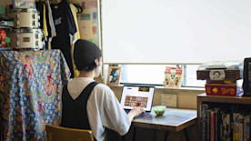 A business owner on their laptop managing their online ordering page