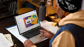 Person creating online store on laptop