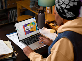 Person creating online store on laptop