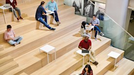 overhead photo of people sitting on a stair structure