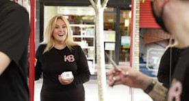 Leslie Guigley, owner of Killiney Barbers, holding at T2