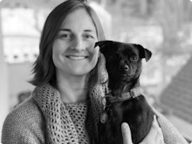 Photo of Leah Llach holding her dog