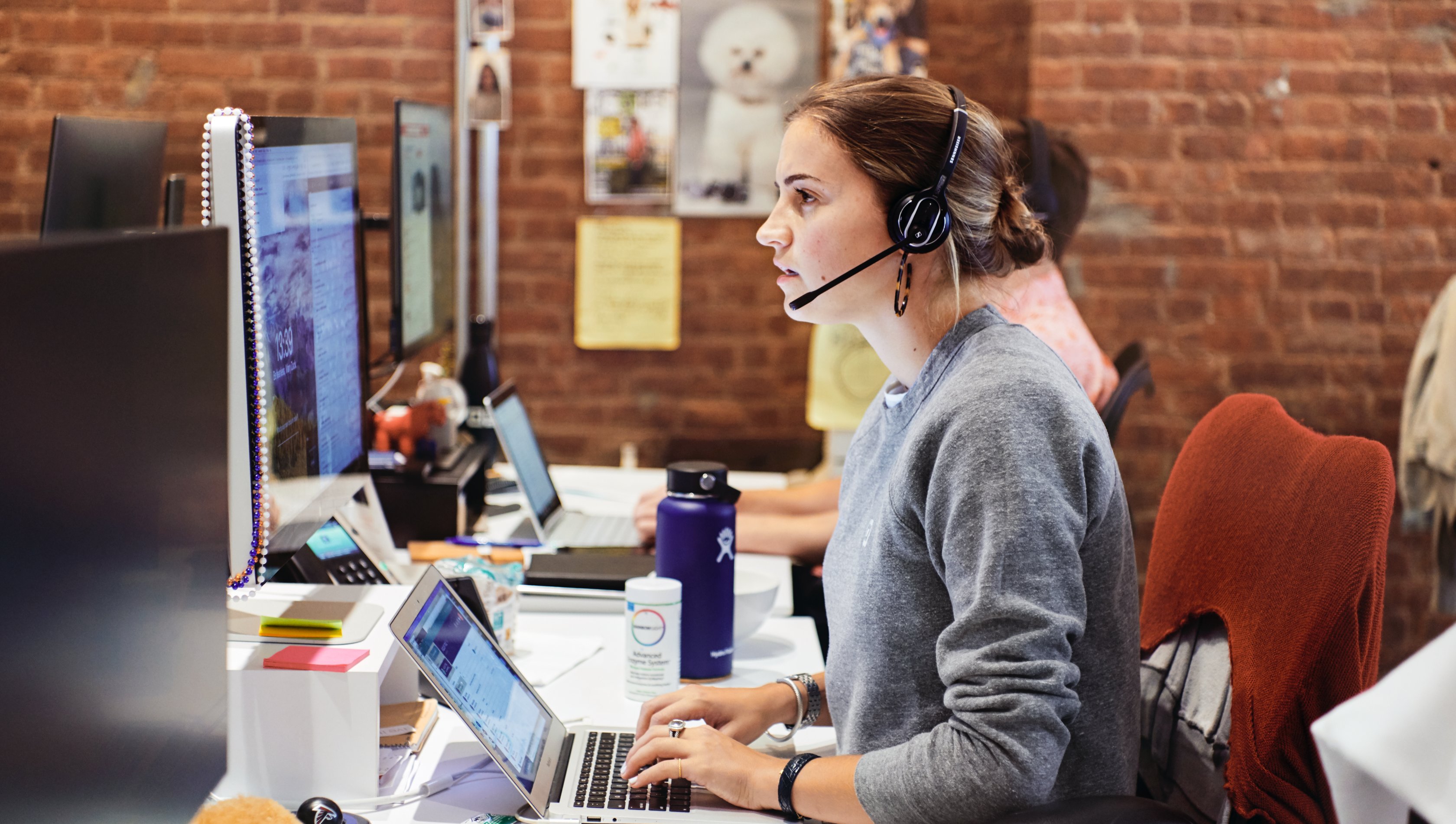 photo of a person working with a headset on