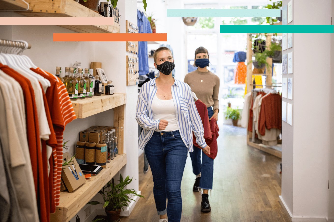 Two shoppers in a retail store wearing masks, having an in-store shopping experience.