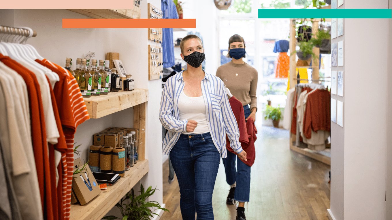 Two shoppers in a retail store wearing masks, having an in-store shopping experience.
