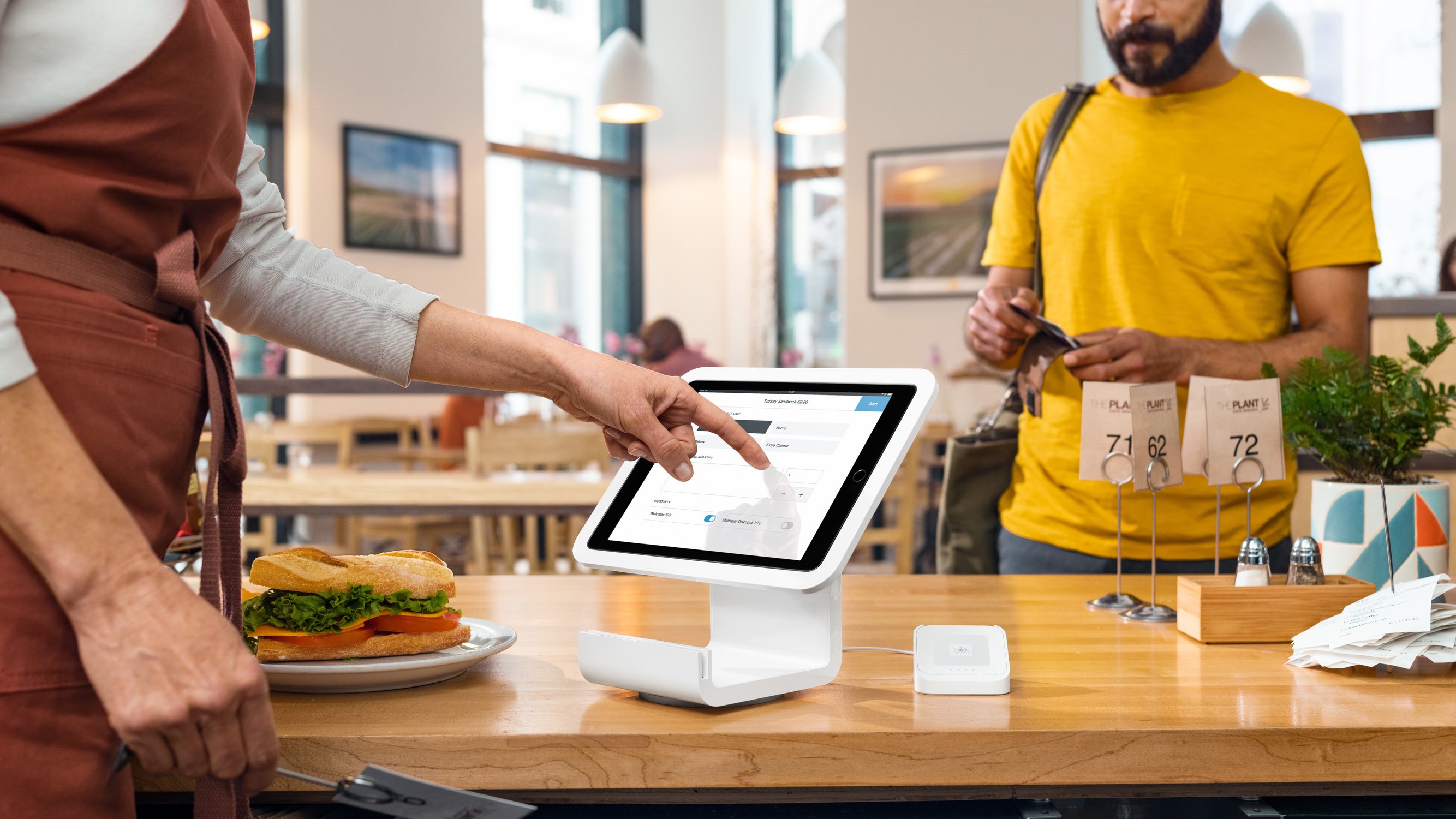 Photo of a Square Stand on a countertop in a cafe