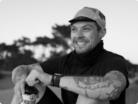 Photo of Mat Cormier holding a bottle of kombucha