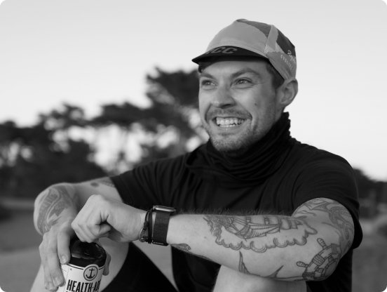 Photo of Mat Cormier holding a bottle of kombucha