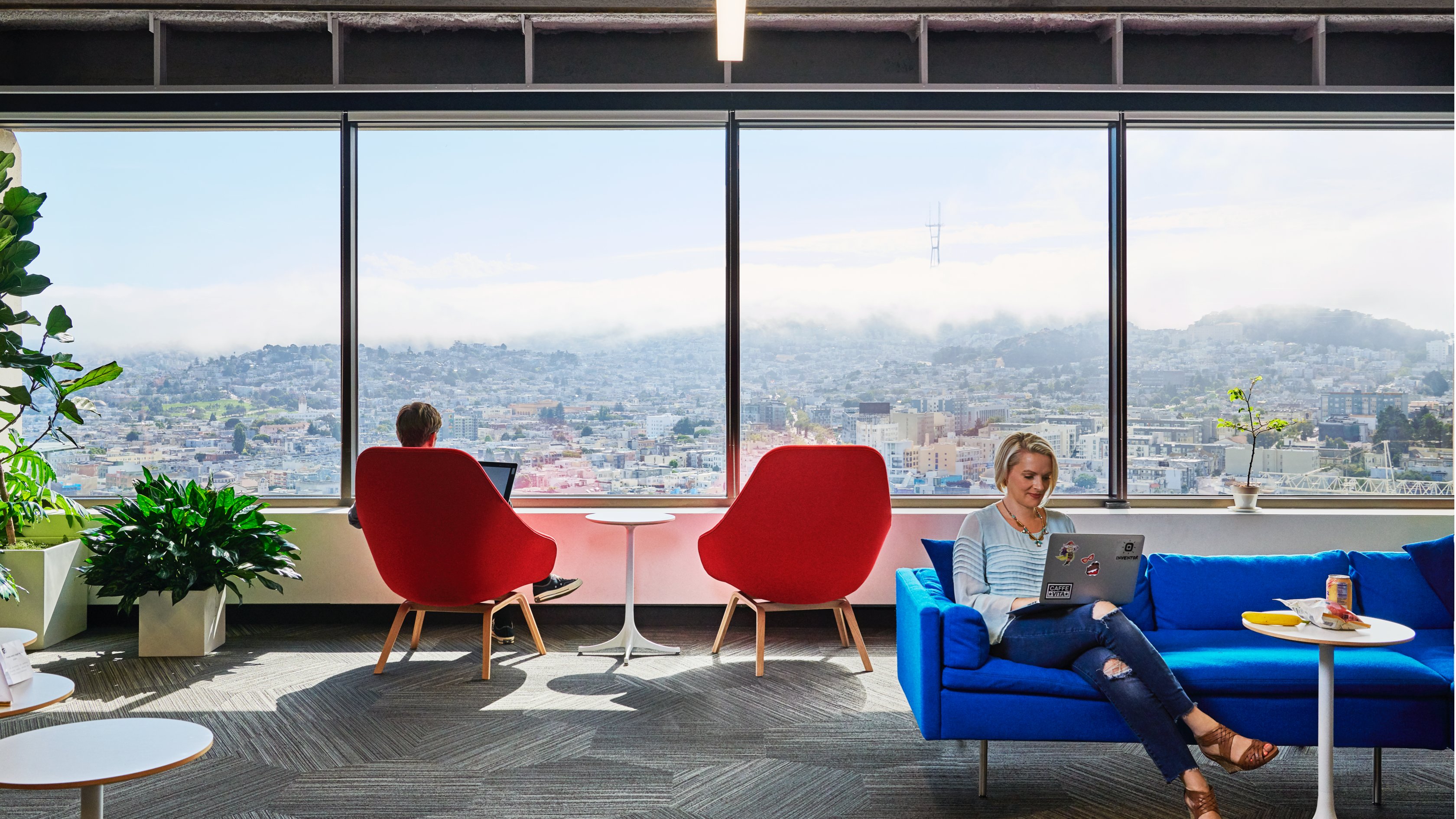 photo of people working with windows in the background