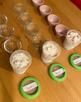 ice cream with 3 rows of dishes and labeled lids that read guar, agave and tapioca