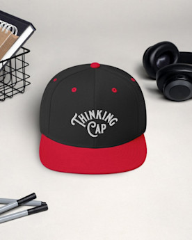 A black and red flat-brimmed hat that reads “Thinking Cap”