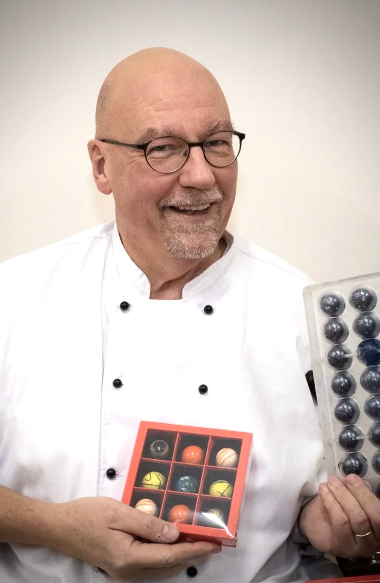 Owner Axel holding a box of chocolates