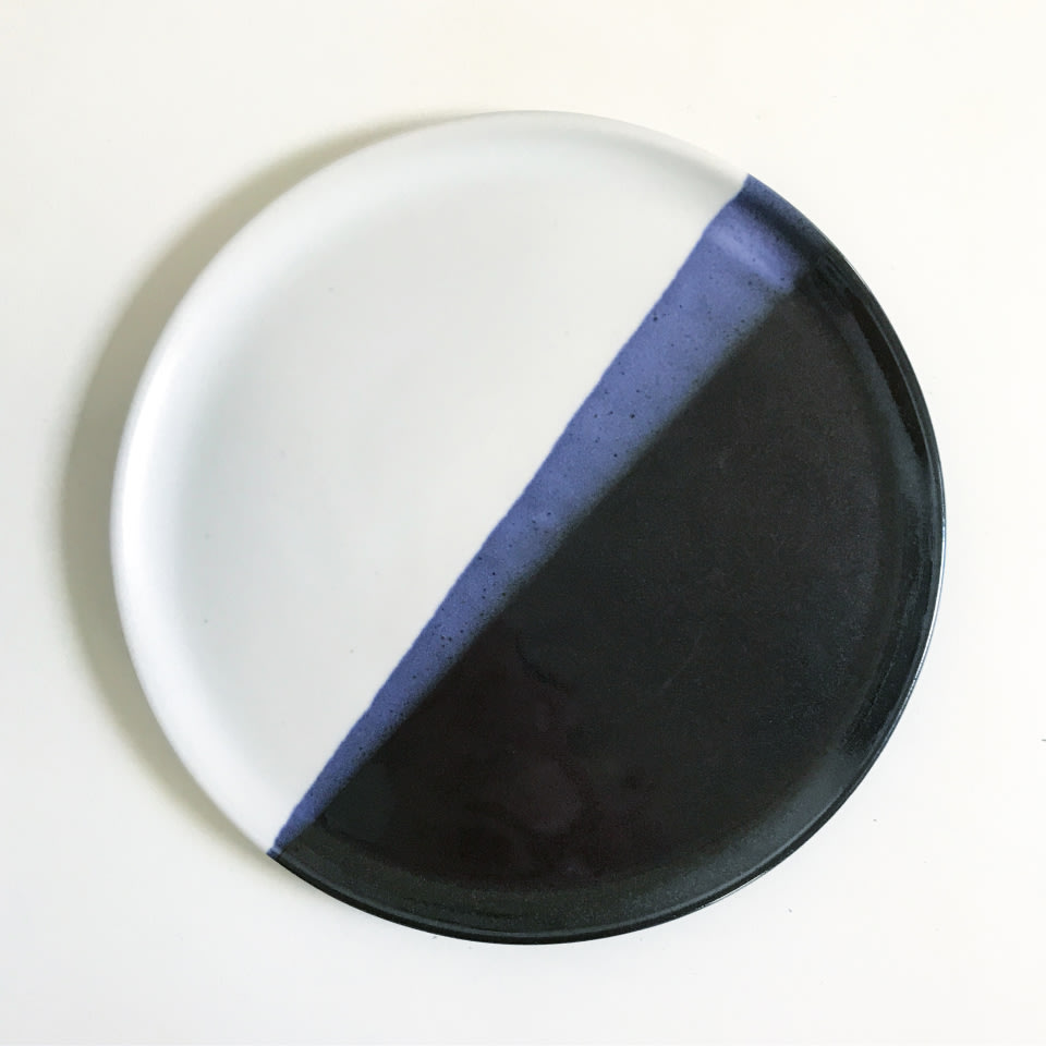 a dyed plate with black and blue accents