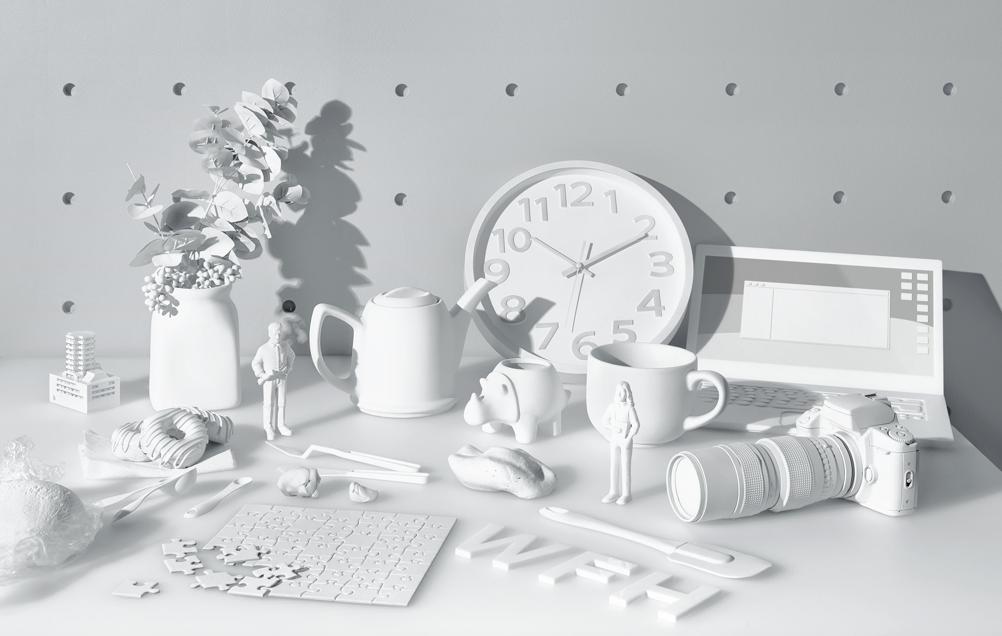 a photo of an assortment of white objects on a white table surface with a white pegboard in the background