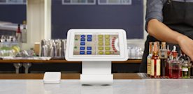 The Touchbistro app running on Square Stand on a bar counter