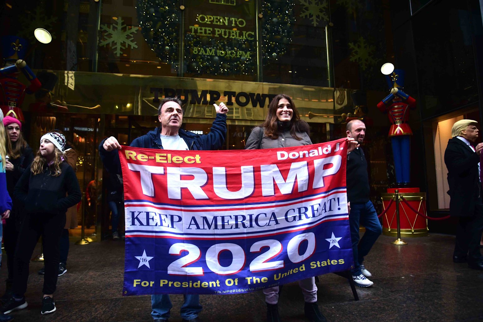 NEW YORK, NEW YORK-DECEMBER 2019- Trump supporters hold a banner in front of Trump Tower in Manhattan, supporting the president for re-election in 2020 - PC-Joe Tabacca