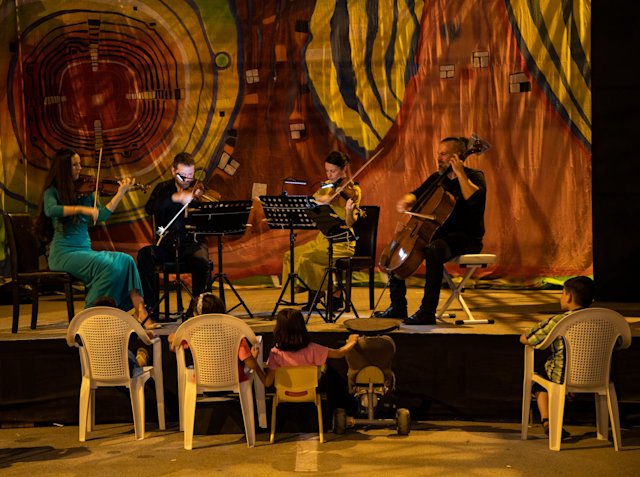 Musicians from Qatar Foundation present a musical evening for Afghan refugees in Doha - QF - 03