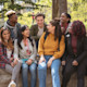 A group of international students sit outside on the campus of their Hispanic-Serving Institution (HSI) university in the US
