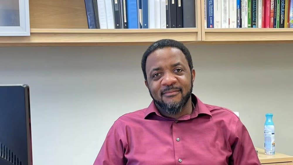 Chukwudi "ChuChu" Chidume at his office, behind his PC