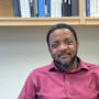 Chukwudi "ChuChu" Chidume at his office, behind his PC