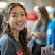 An Asian female international student volunteers for her extracurricular activity at her US university