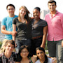 A group of international students posing for a picture with New York City in the background