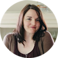 Writer Kate Knapp stands and smiles for the camera