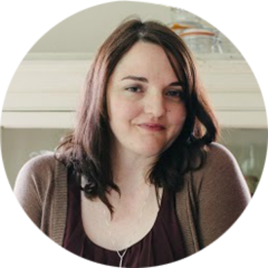 Writer Kate Knapp stands and smiles for the camera