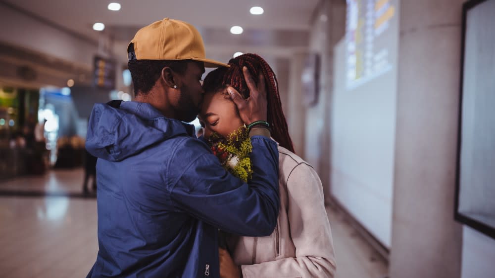 A male student consoles his girlfriend