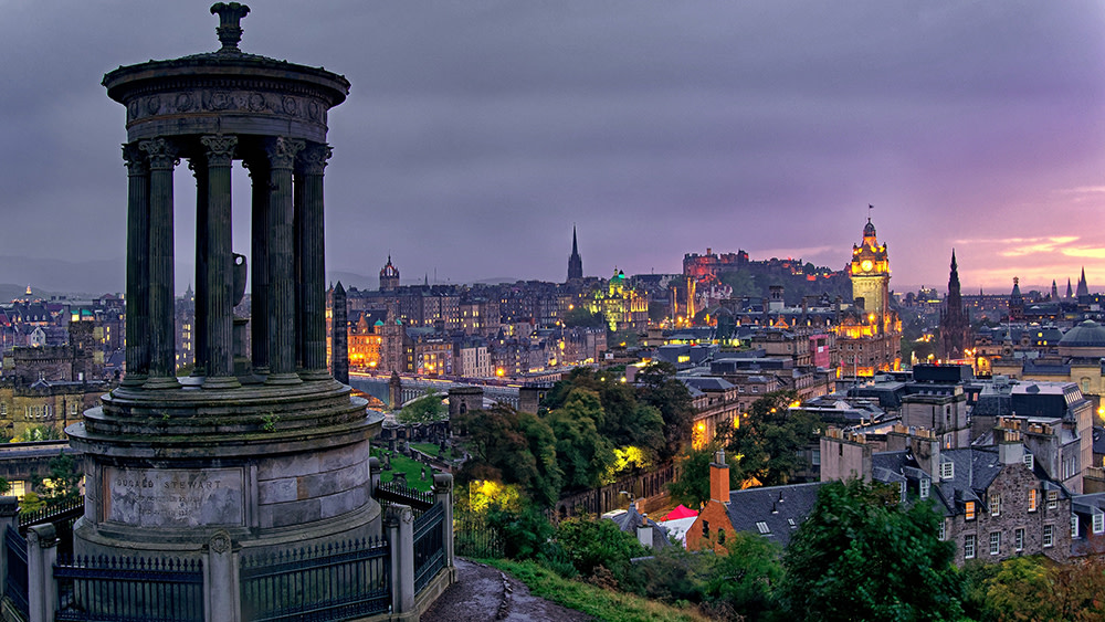 A skyline view of Edinburgh, Scotland, at dusk