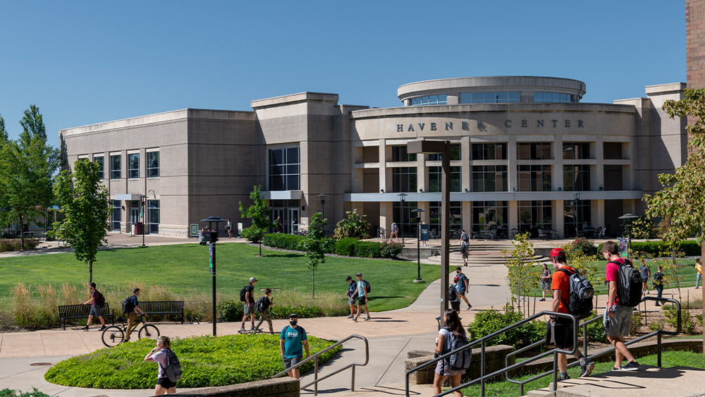 Missouri S&T students walk on campus in front of the university's Havener Center building.